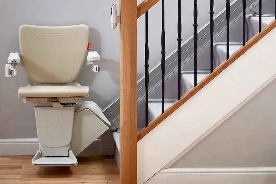 Freedom Stairlifts Straight Stairlift 2 with natural colour upholstery open at the foot of the stairs