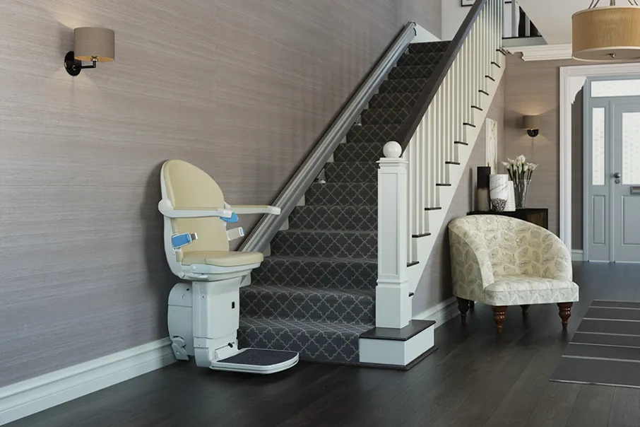 Freedom Stairlifts Straight Stairlift 3 with natural upholstery in the open position at the foot of the stairs