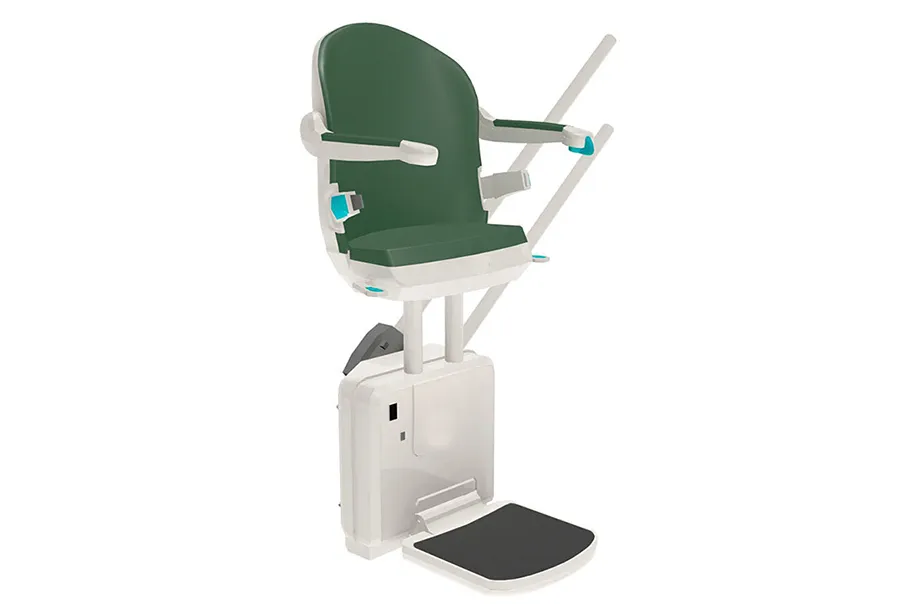 A Freedom Stairlifts Curved Stairlift in a perch seat with green upholstery.