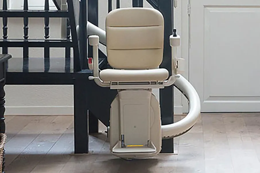 Freedom Stairlifts single track Curved Stairlift 3 with cream upholstery.