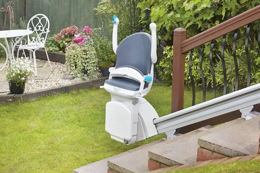 Freedom Stairlifts Outdoor Straight Stairlift at the foot of the garden steps in a folded position